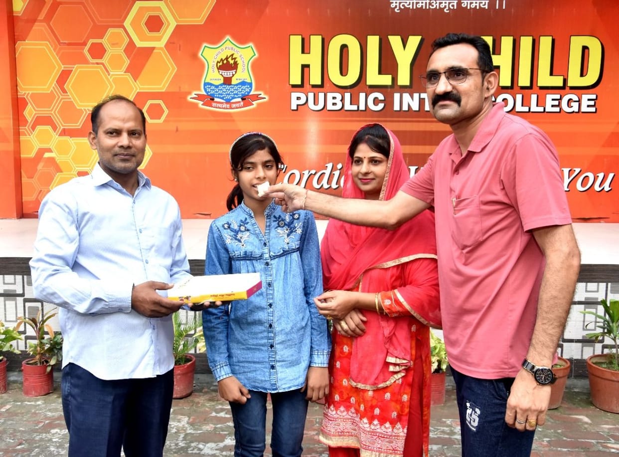 UP board high school topper Divya honored