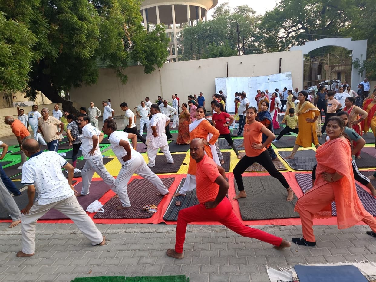 Festive atmosphere from city to village, people engaged in yoga