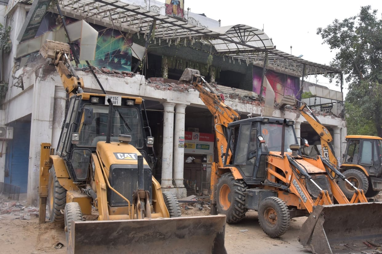 Corporation's bulldozer ran on the verandah of the hotel on the road