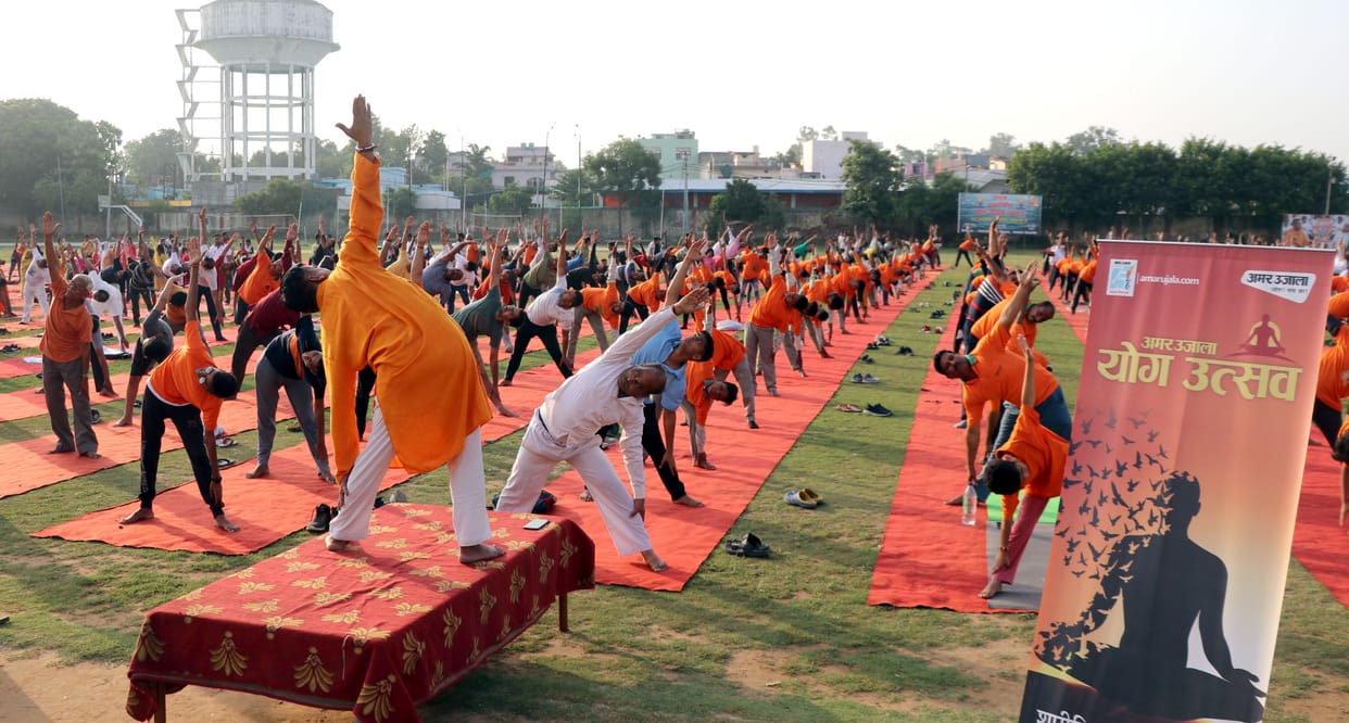 Sadhaks did yoga in the stadium on International Yoga Day