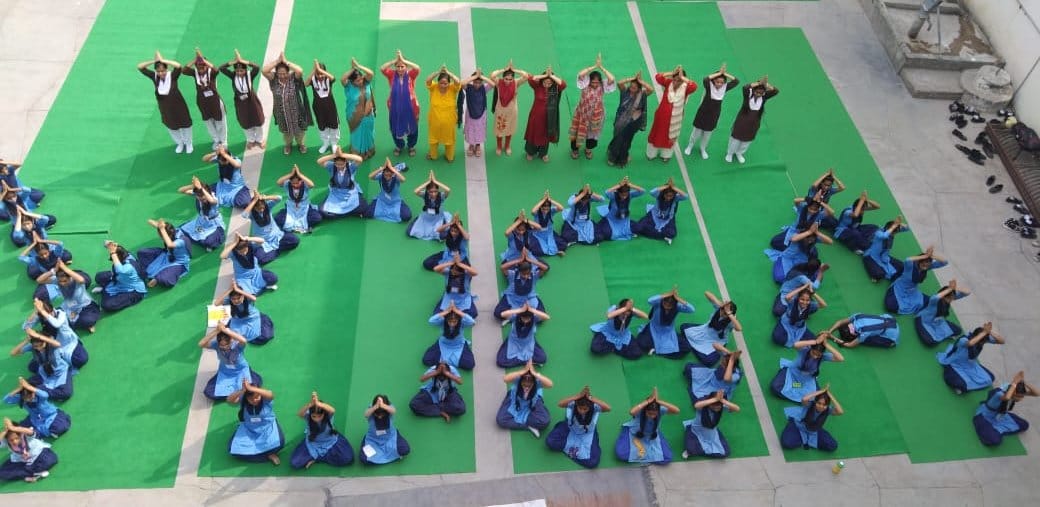 People immersed in yoga from village, street to city