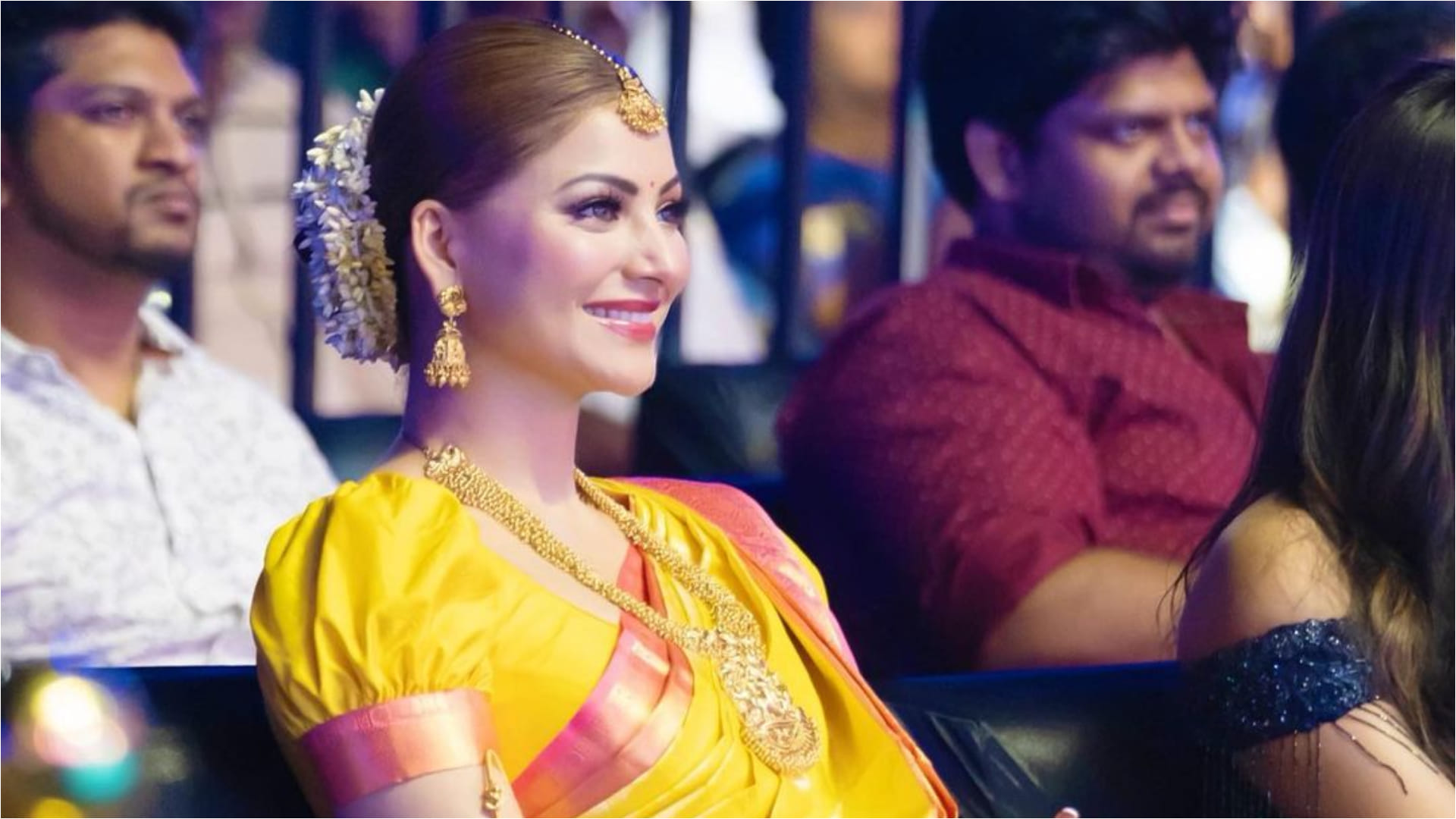urvashi rautela yellow kanjivaram saree gold jewellery traditional look for movie trailer launch