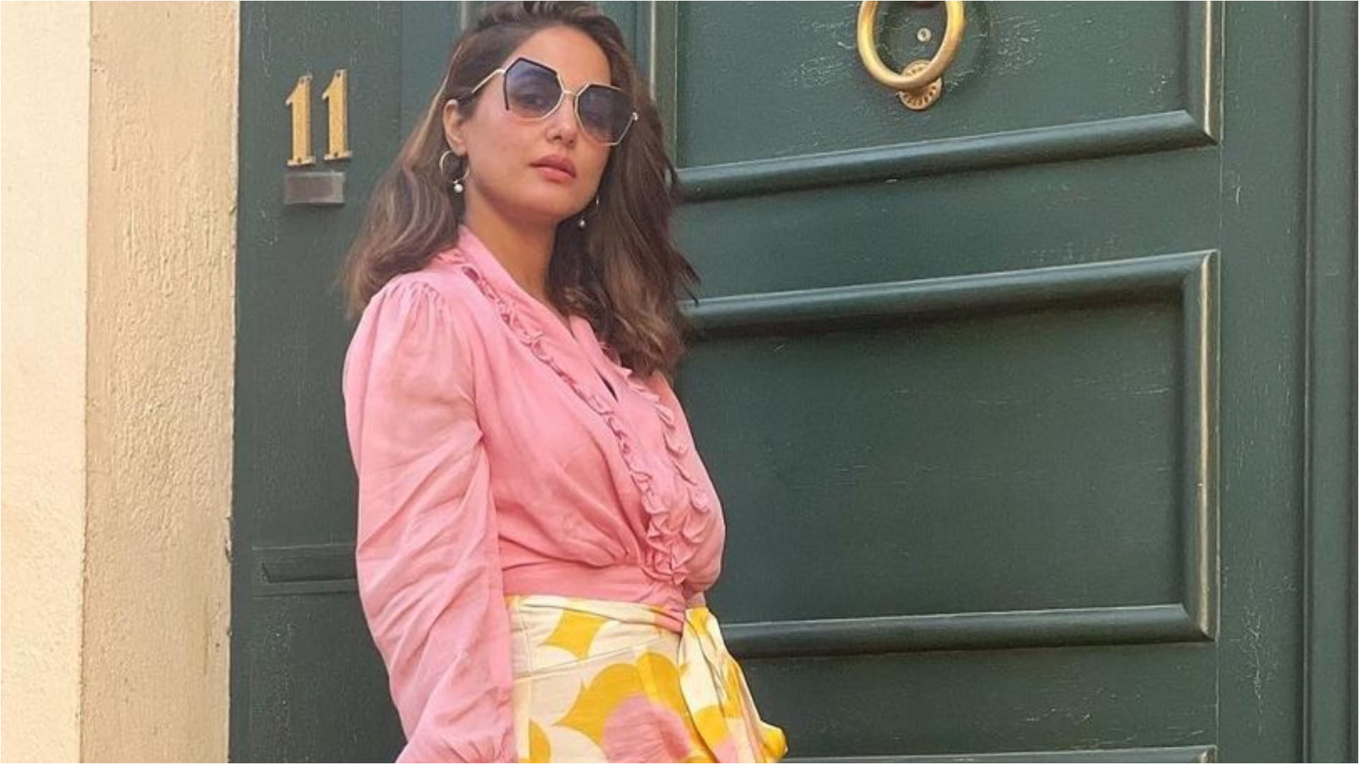 hina khan style in printed asymmetric skirt with pink crop top look gorgeous