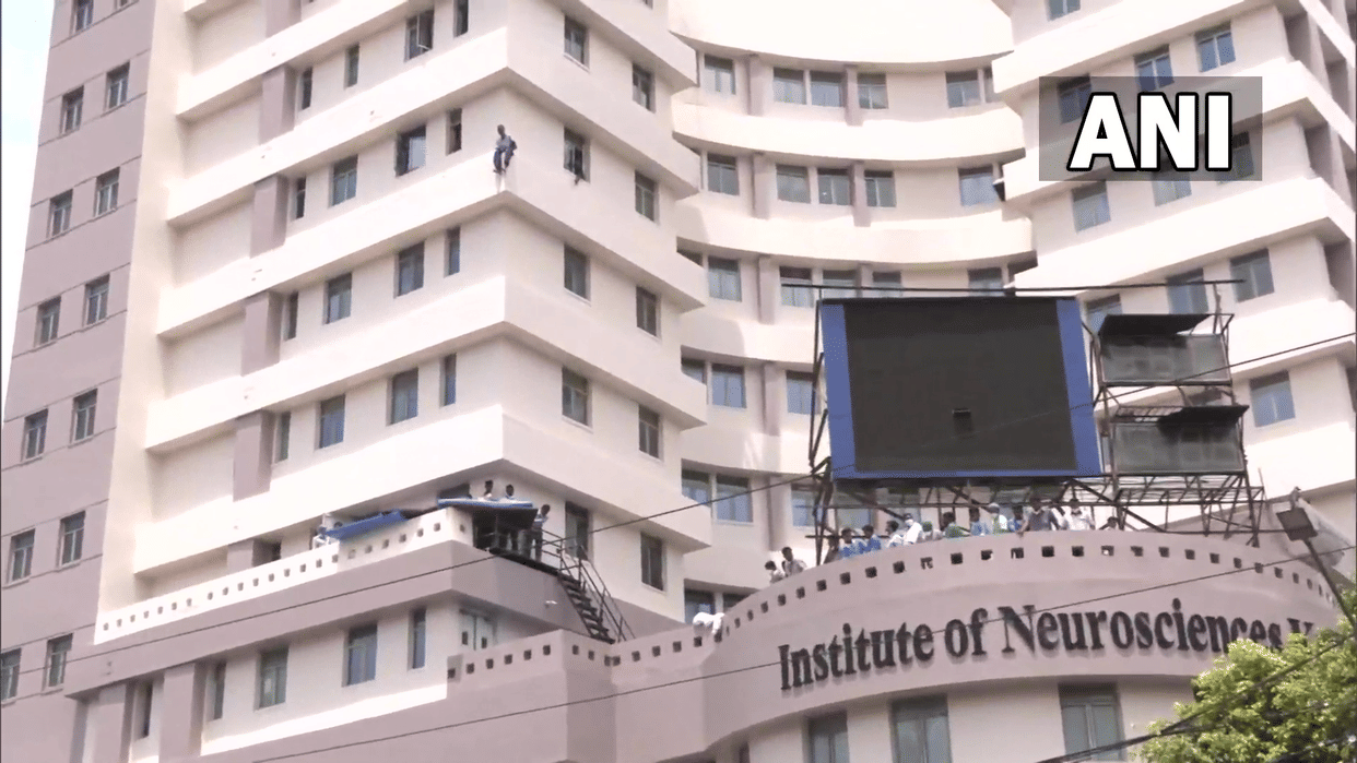 West Bengal:  A patient climbed out of a ward to sit on a highrise edge of the Institute of NeuroScience Hospital
