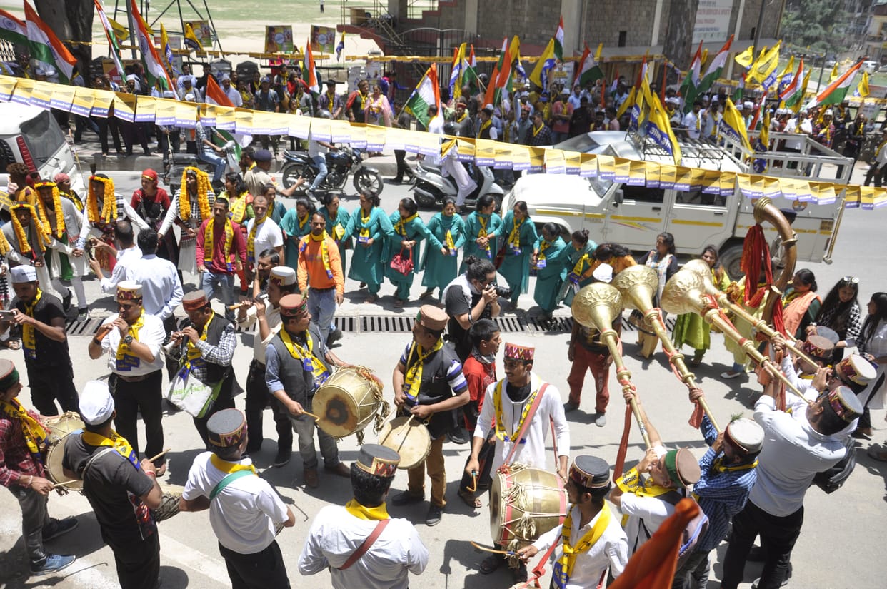 Waiting for Kejriwal dancing and singing in the sun