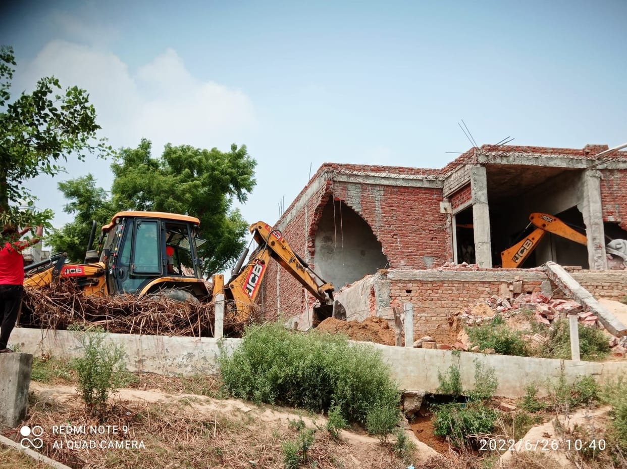 The head's husband built shops on the land of the pond, bulldozers run