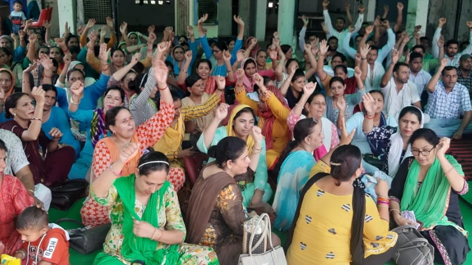 NHM workers working in health department in Jind went on strike over their demands