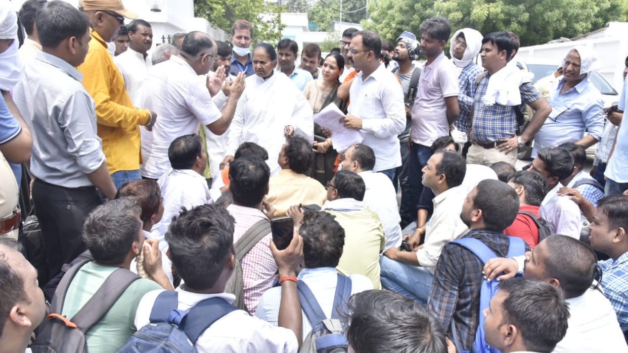 Education minister Gulab Devi meets to teachers who were protesting near her office.