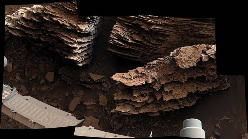 Earthen mounds and flaky stones seen on Mars by NASA rover