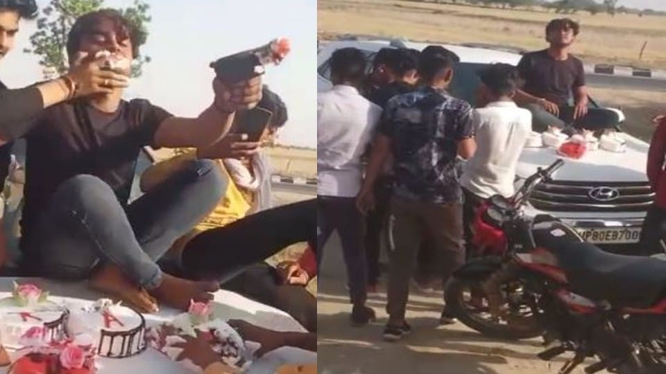 young man cut cake with pistol on bonnet of car in Firozabad
