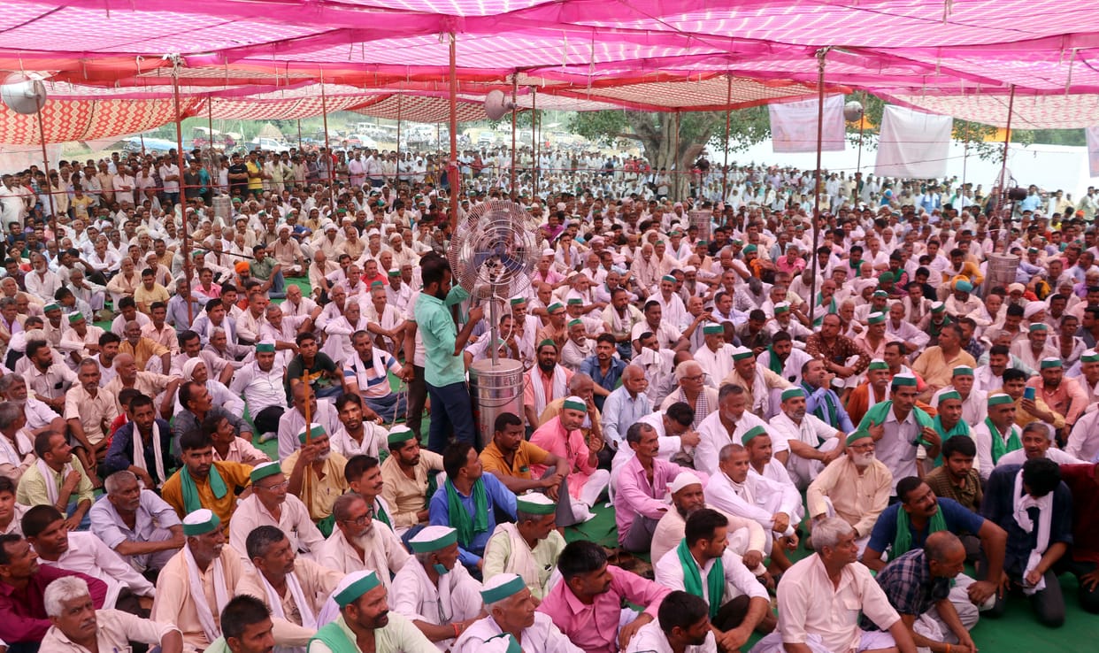 Farmers stood for seven hours in the scorching heat