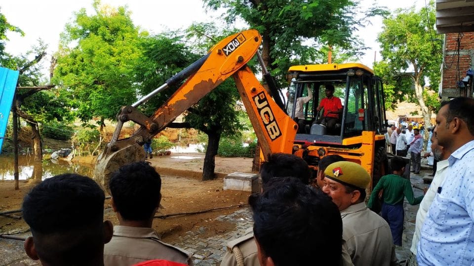 Illegal encroachment on government lands demolished by bulldozer in Agra