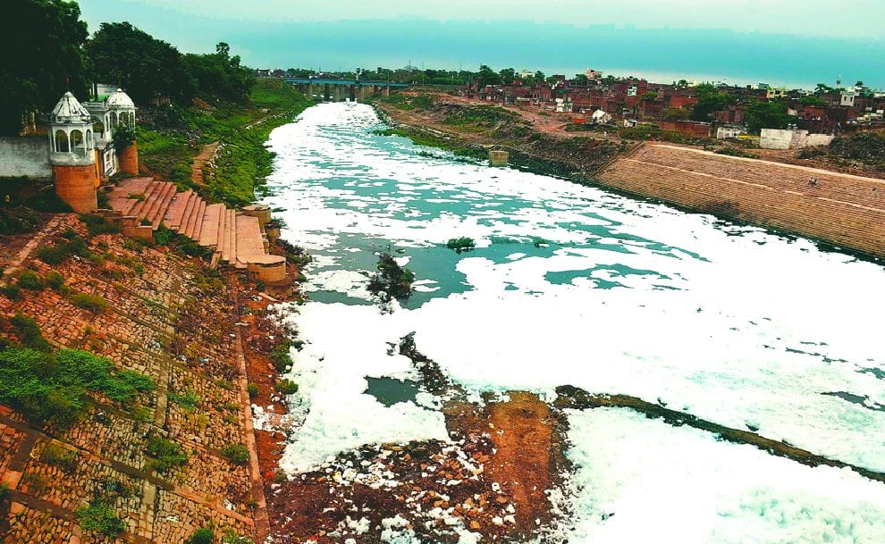 dirty sheet of white foam covered Varuna river in varanasi officer said will be investigated