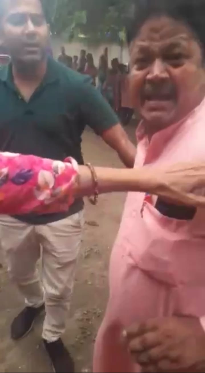 headmaster throw stone on teacher