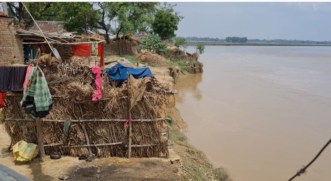 Villagers demolishing their own shelter due to fear of erosion
