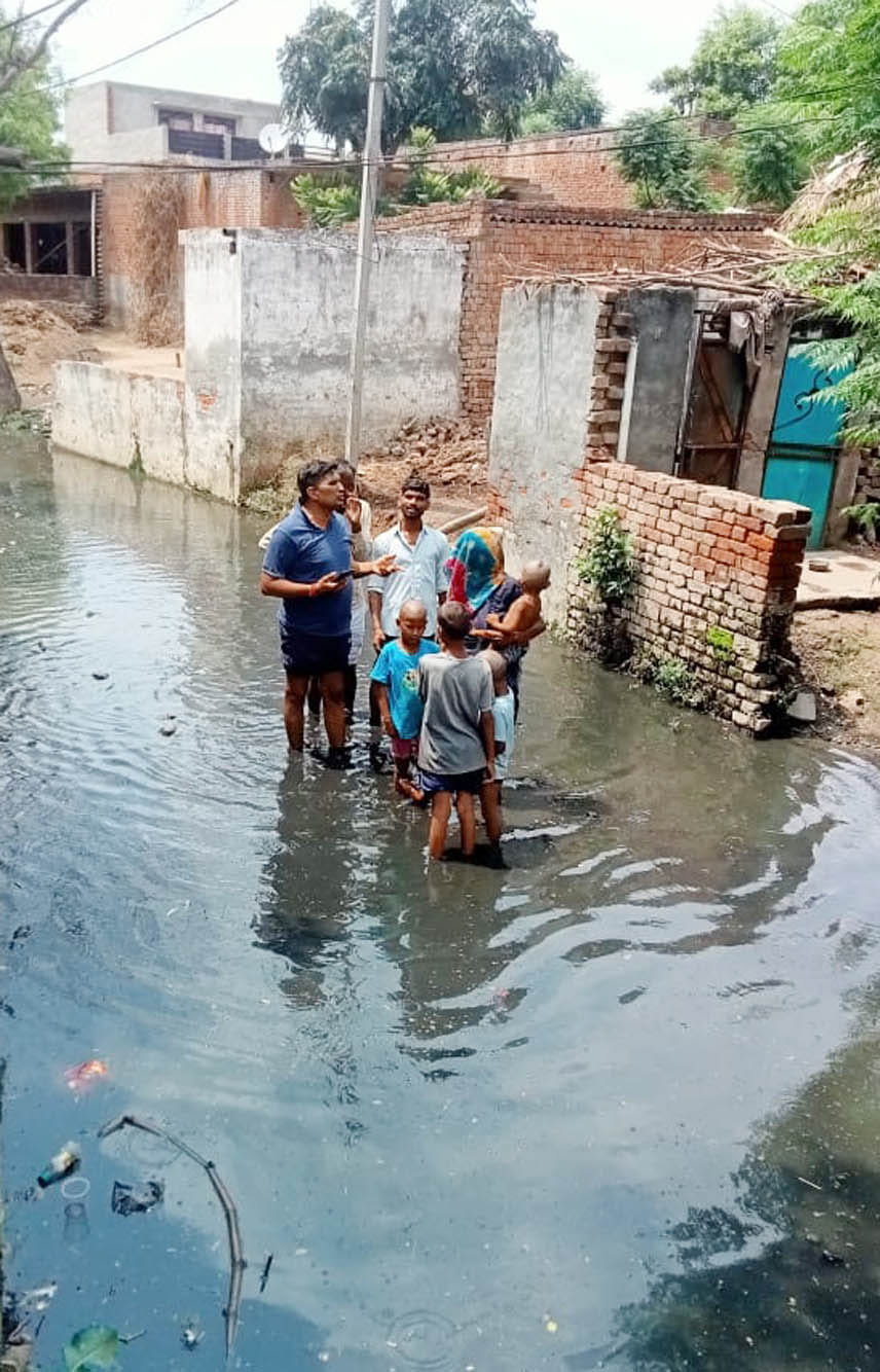 Pond overflows, water filled the road and houses