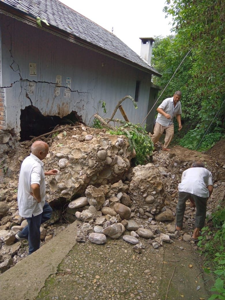 rain damage; House damaged due to falling debris from hill, scooty buried