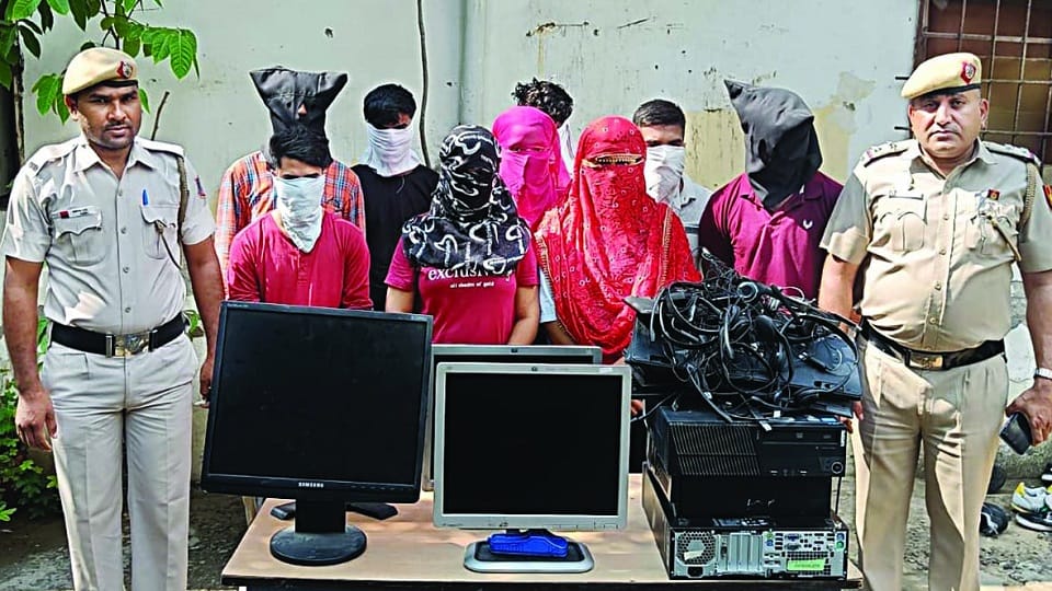 delhi police raid on a fake call center in naib sarai used to cheat citizens of america 12 arrested