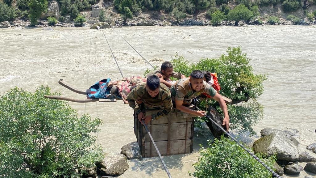 Indian Army evacuated young person across Chenab river who met accident while working in field with tractor in kishtwar