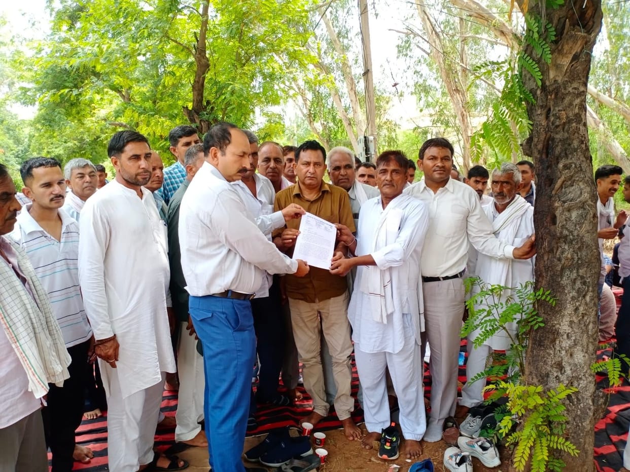 Employees raised their demands by staging a dharna
