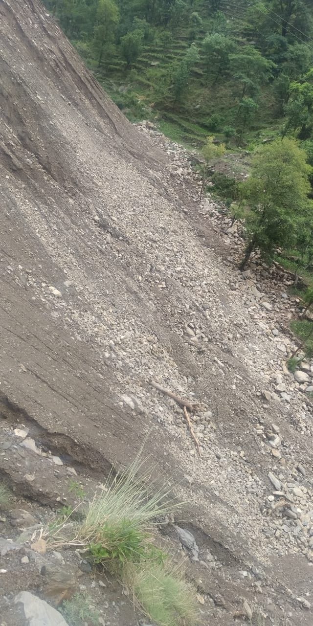 Tonnes of road debris thrown near the ground, grasslands, gharat