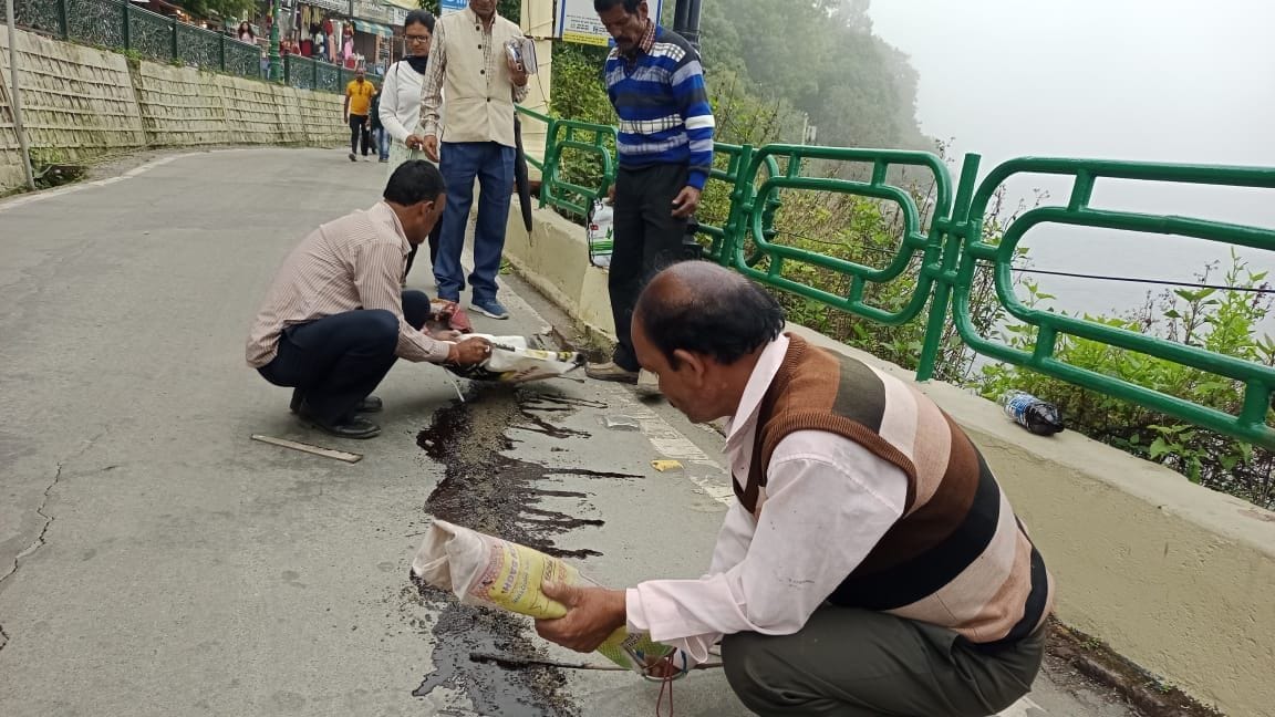loniv filled the cracks in the mall road with asphalt