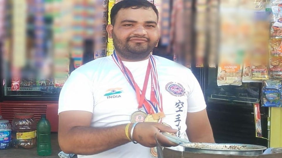 international karate player selling tea at stall in mathura
