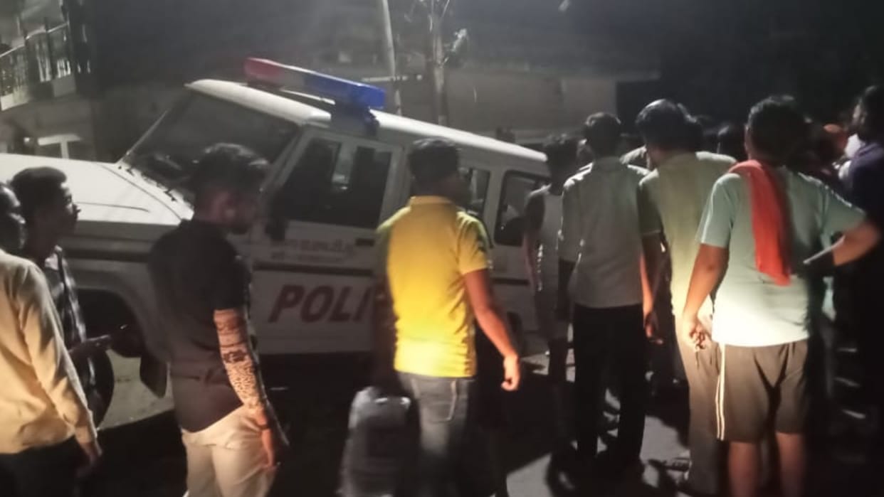 A police van hits road vendors in Raebareli.