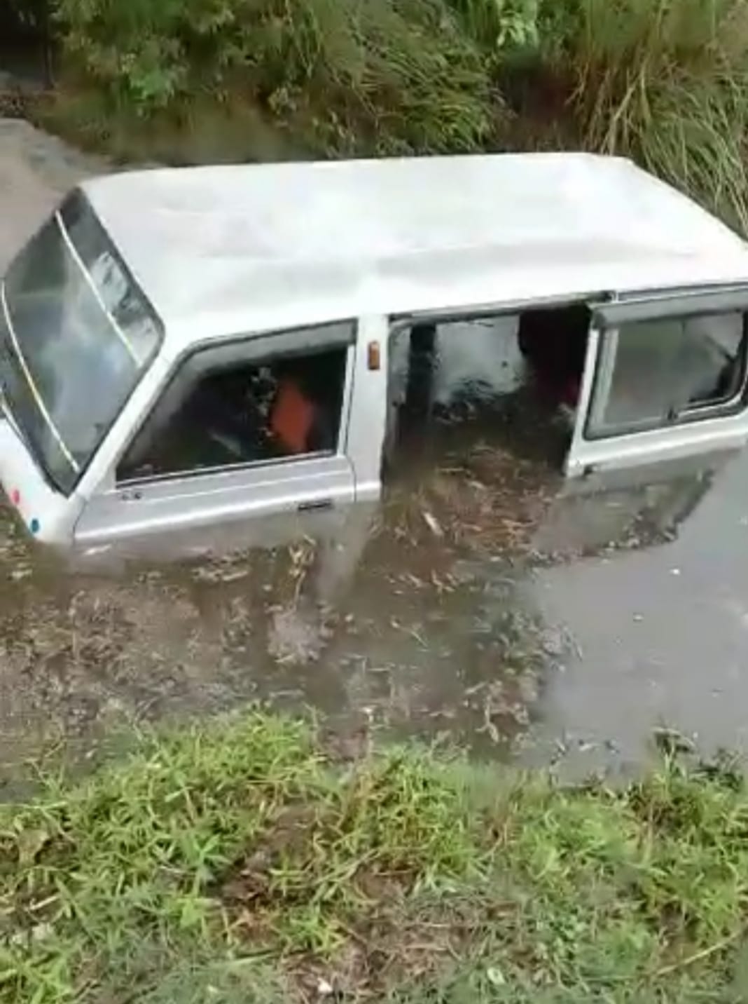 School van full of students overturned in a ditch