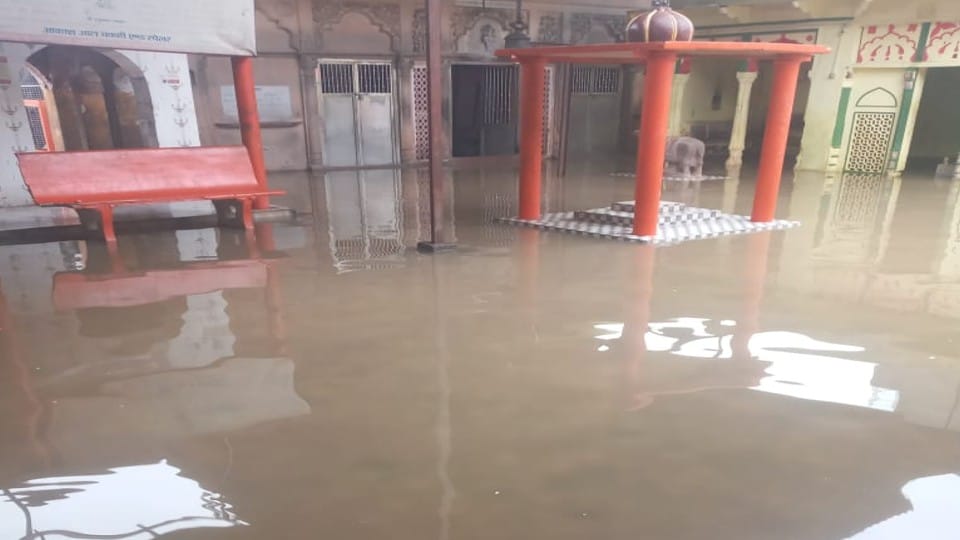 rain water filled in graveyard due to drain wall collapse during rain in Agra