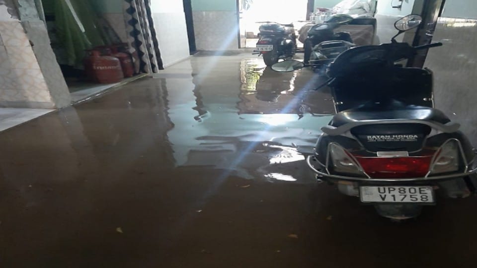 rain water filled in graveyard due to drain wall collapse during rain in Agra