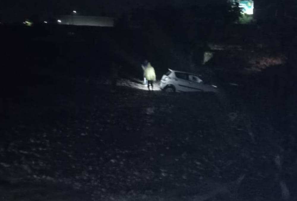 Dehradun weather: Car swept during in heavy flow of flood and Youth died photos
