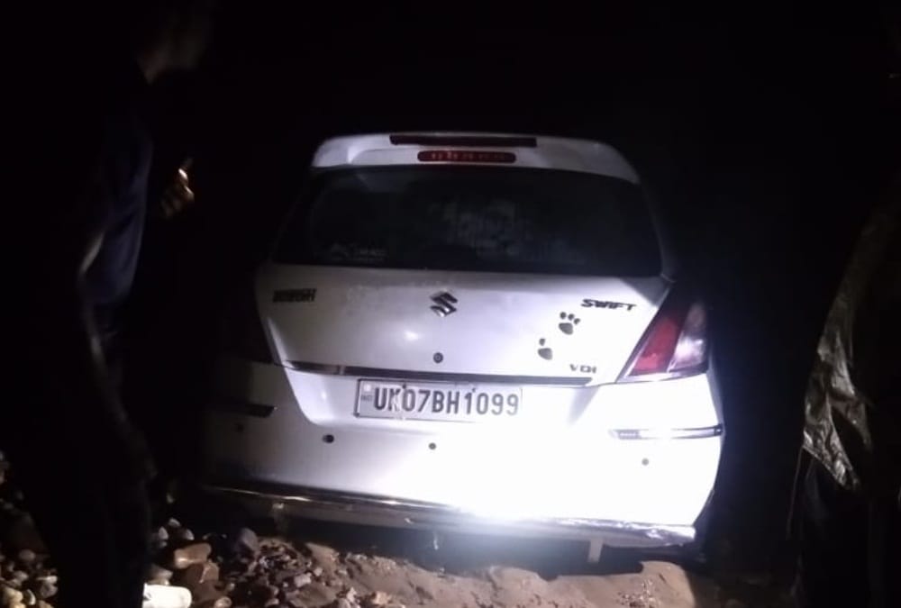 Dehradun weather: Car swept during in heavy flow of flood and Youth died photos