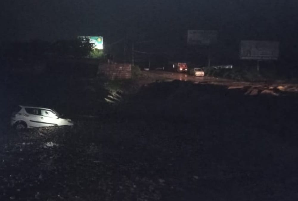 Dehradun weather: Car swept during in heavy flow of flood and Youth died photos