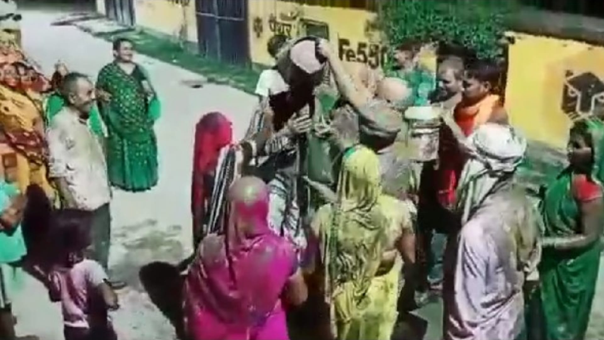 Women bathe Sadar MLA with mud to make it rain in maharajganj