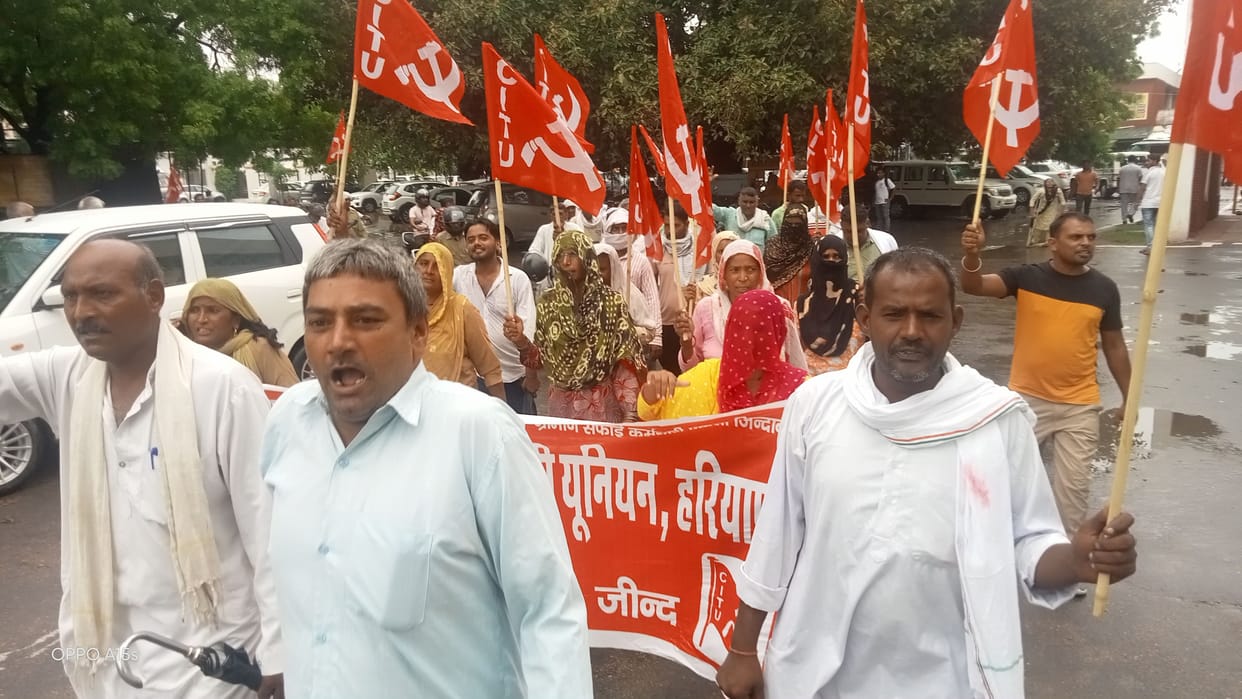 Rural sanitation workers demonstrated amid rain