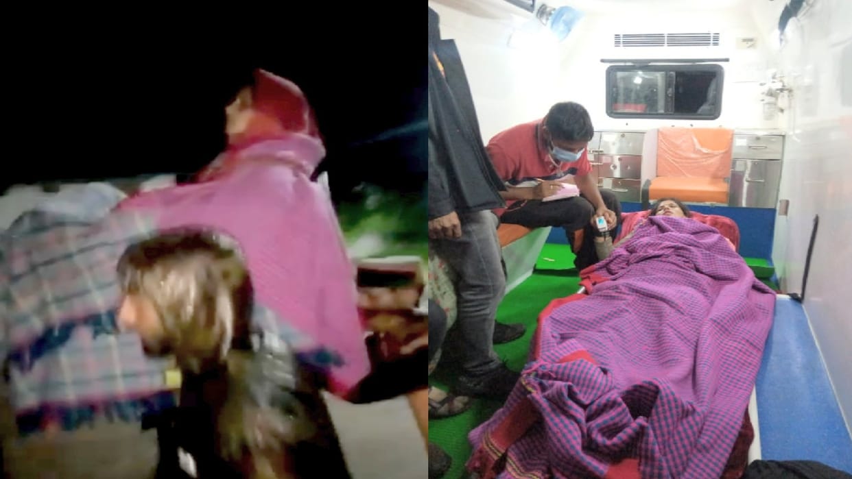 In the midst of heavy rainfall, a sick woman lifted on a chair to reach the road 20 km away