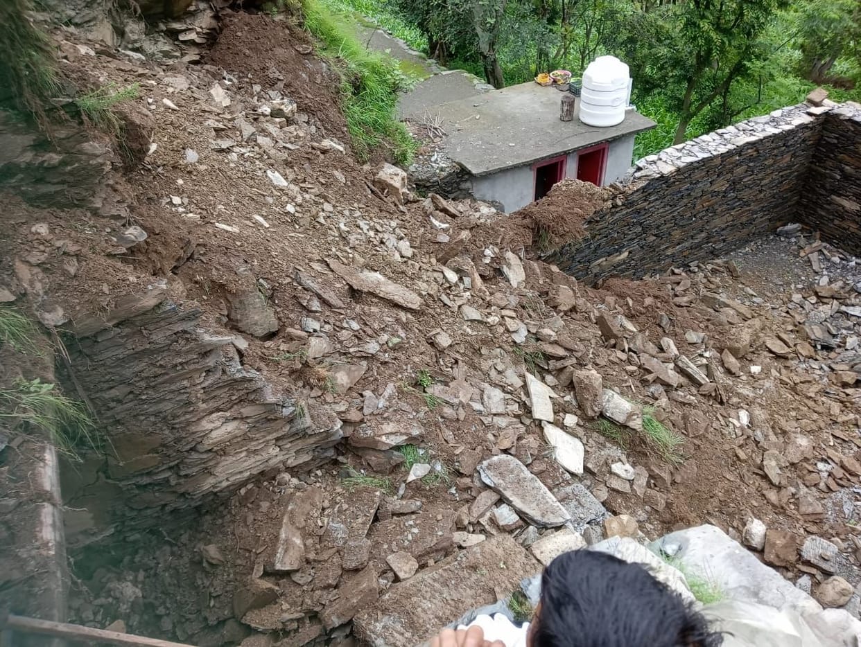 Kitchen and under construction houses damaged by landslide