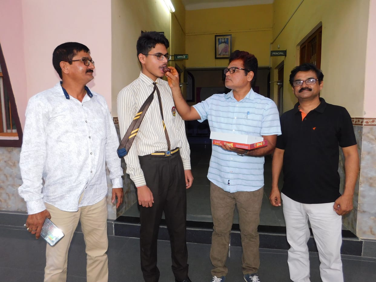 Three students topped the district with 98 percent marks