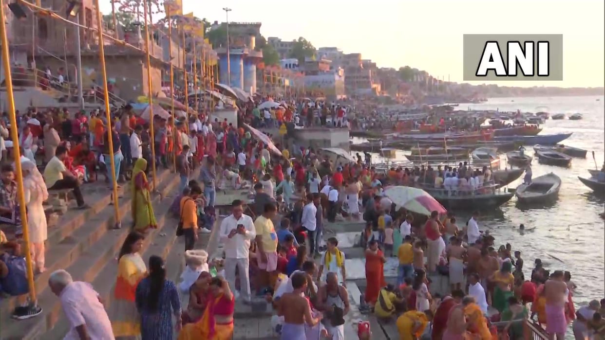 Devotees take bath in Ganges river in Varanasi on first Monday of Sawan