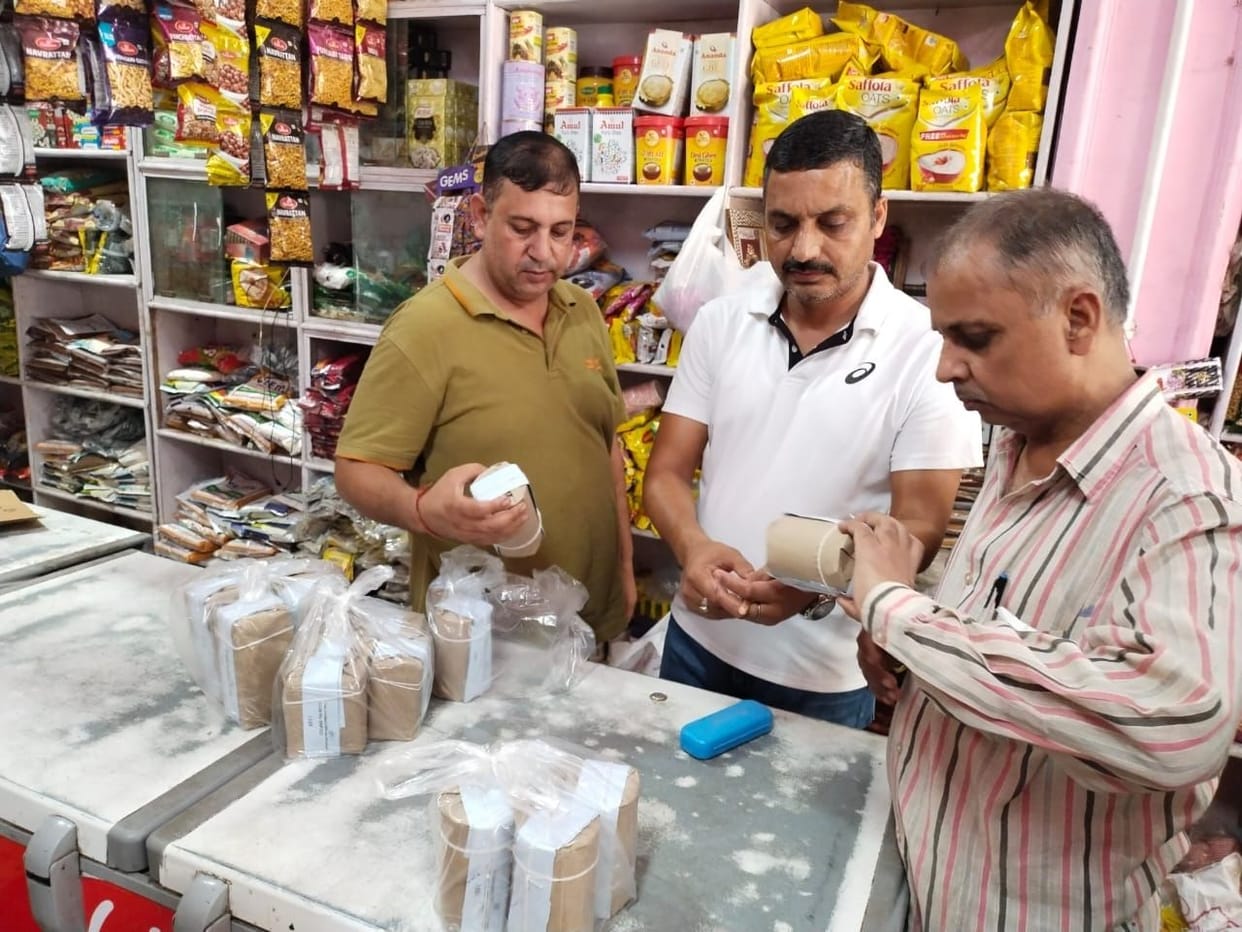 Samples of biscuits, ghee, paneer, curd from salt and dairy from grocery store