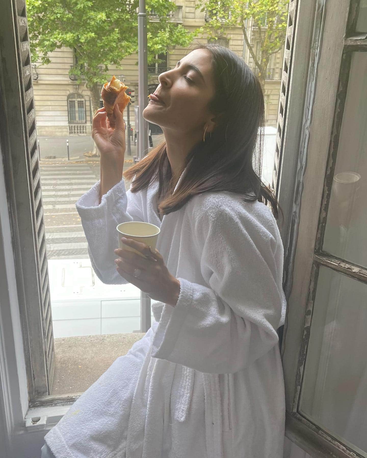 Anushka sharma shares her photos from paris vacation eating  croissants with coffee