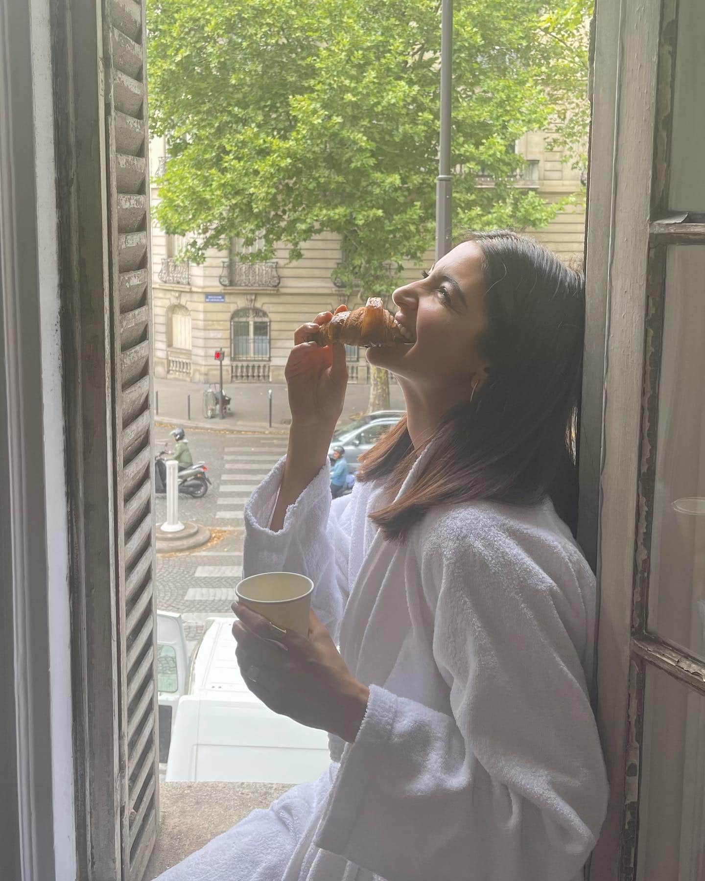 Anushka sharma shares her photos from paris vacation eating  croissants with coffee