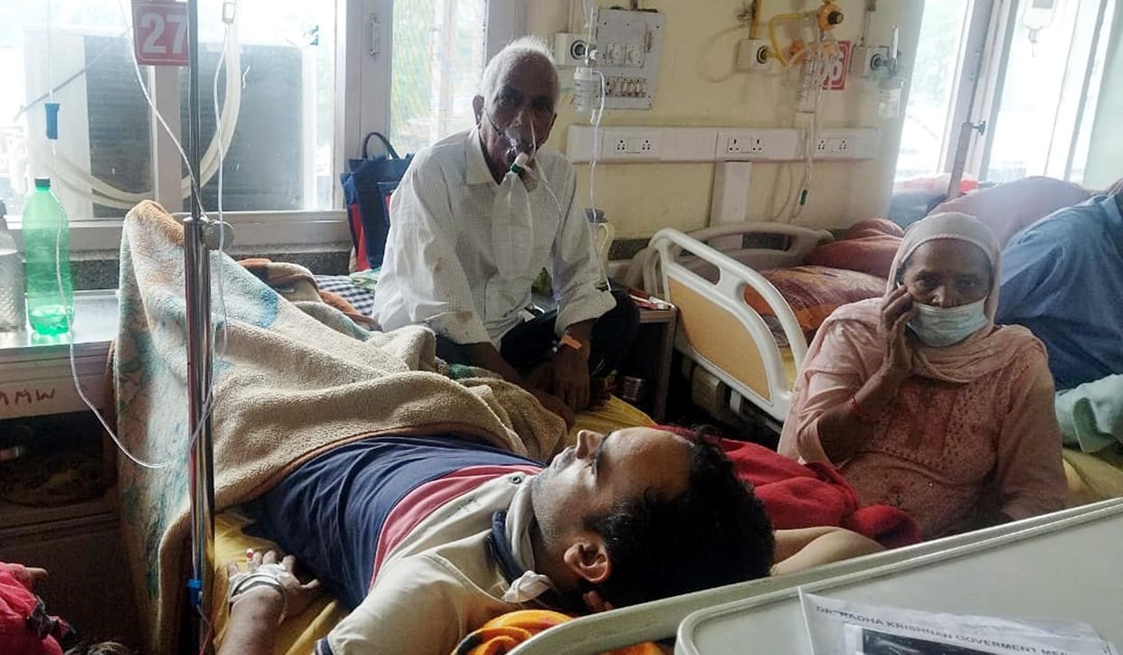 Crowd in Gyani and Medicine wards of Medical College, two patients on one bed