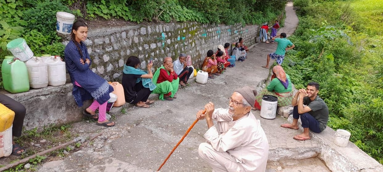 Villagers forced to carry water from water sources