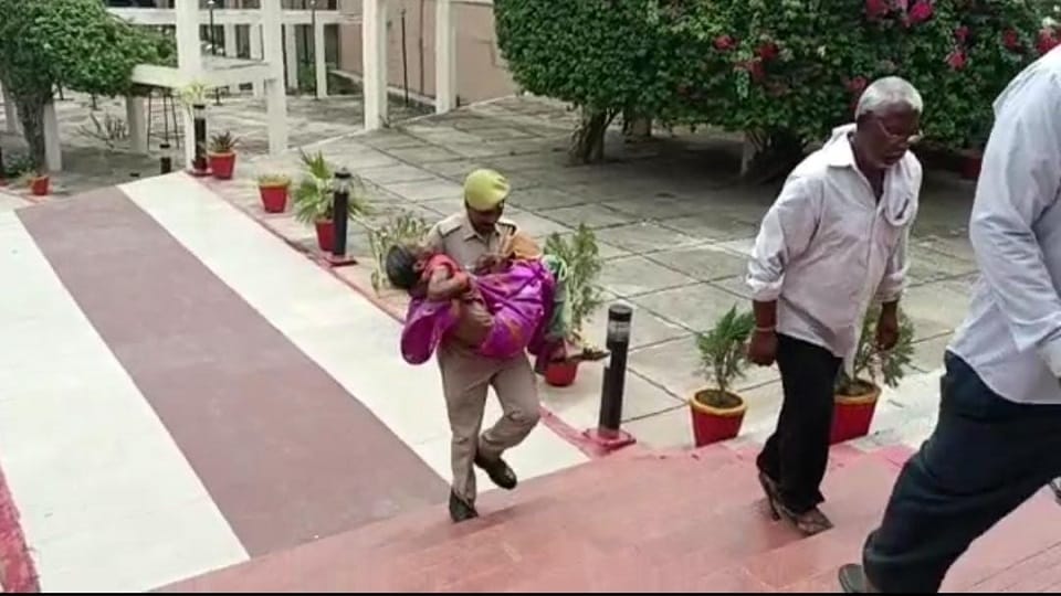 UP Police constable helped old woman picked up in her lap and reaching DM office Firozabad