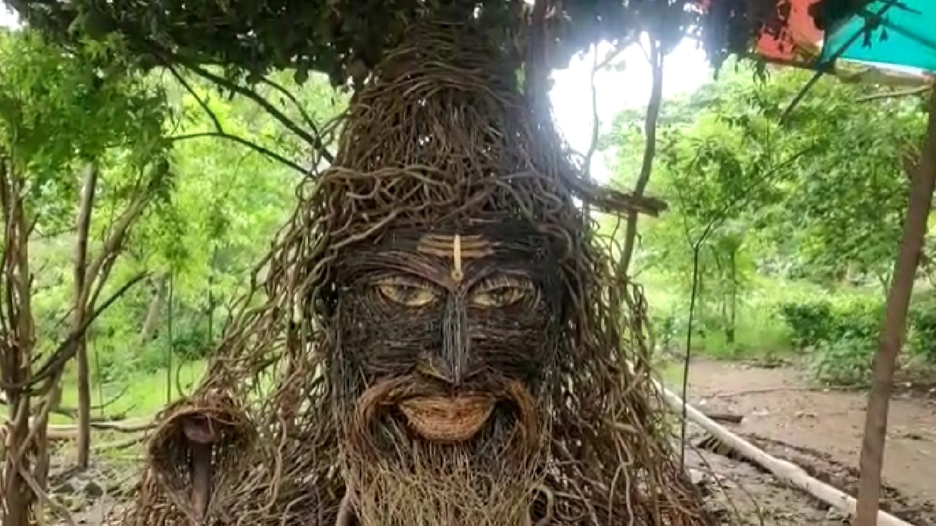 Statue of Mahakal made from tree roots and dry wood in Seoni, people reaching 10 feet high to see Shiva