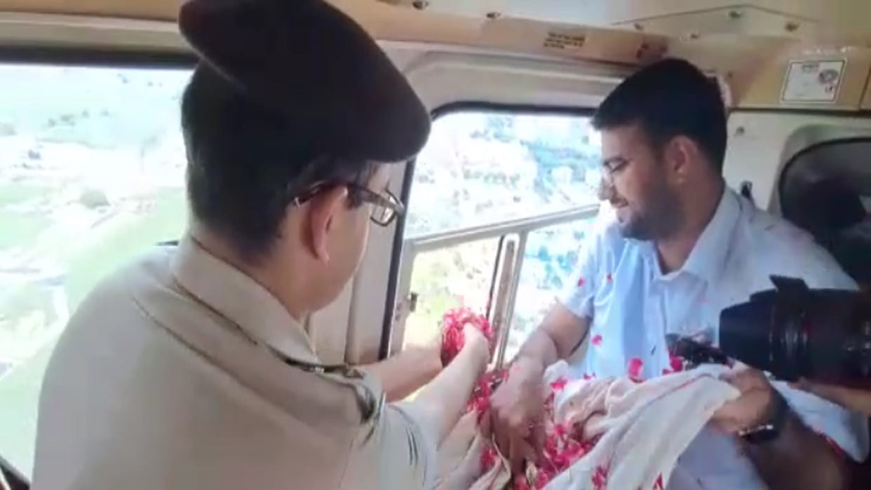 IG Praveen Kumar and DM Deepak Meena of Meerut showered flowers on kanwariyas from helicopter see photos