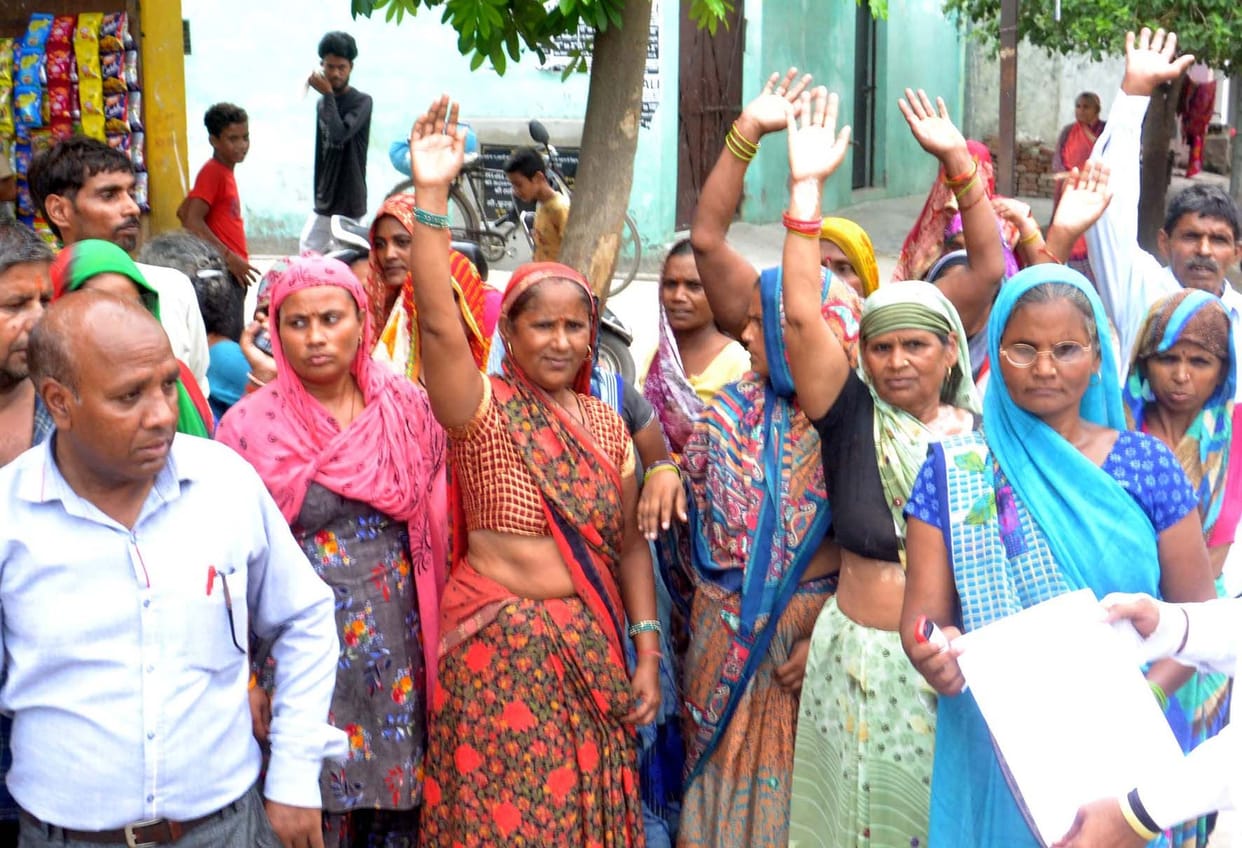 Women sit on dharna over waterlogging