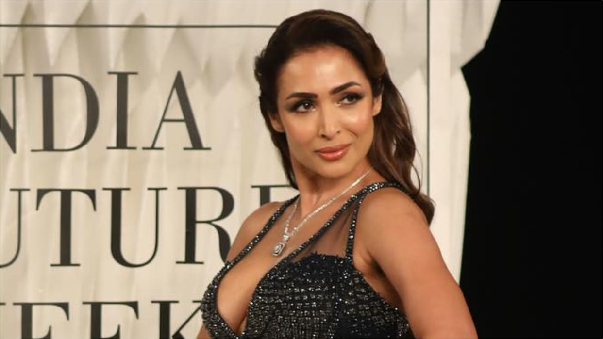 malaika arora walk the ramp in extremely bold deep neck gown